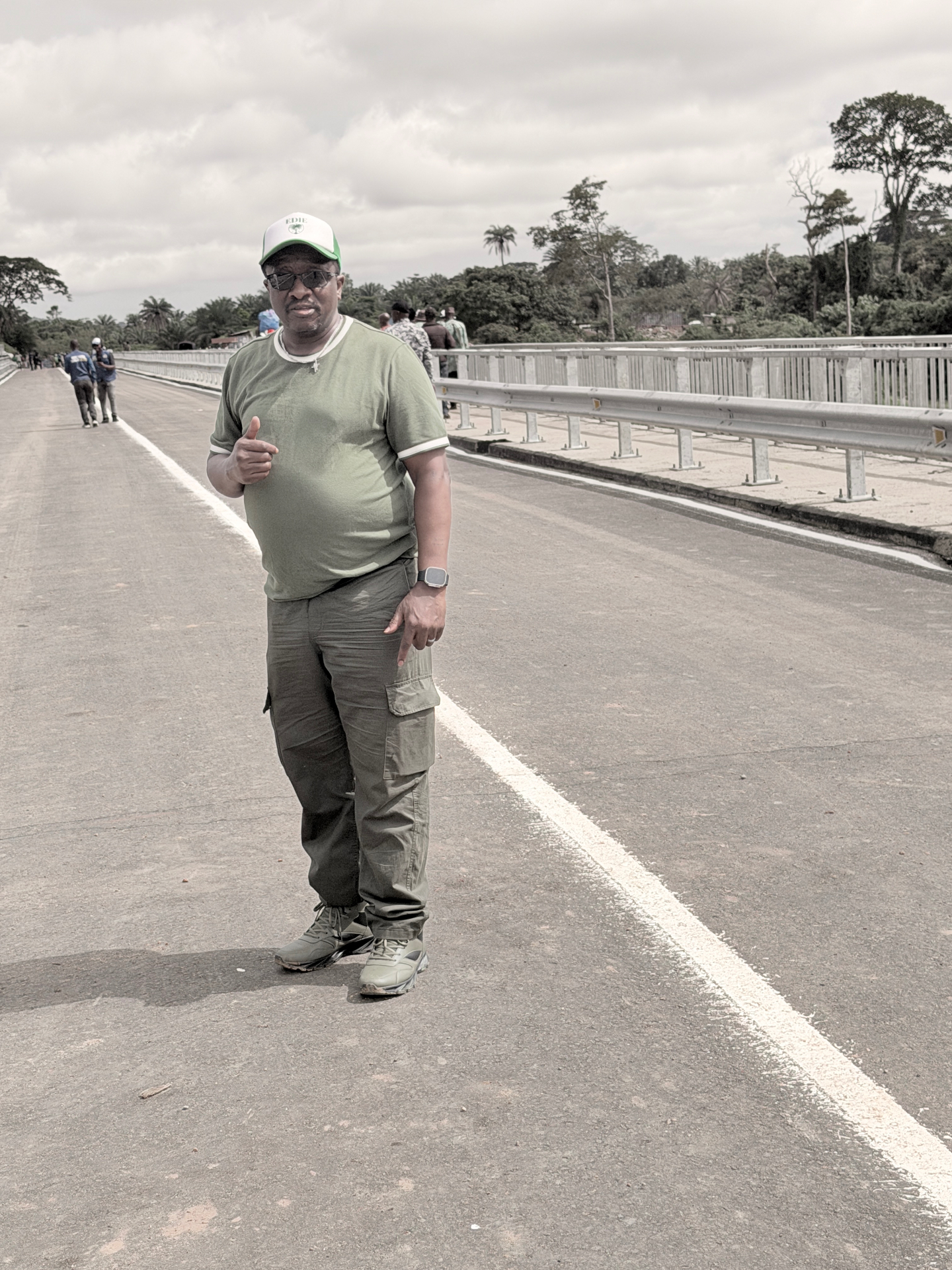 Edie P. Vandy, Regional Secretary General of SLPP North America, photographed standing on a bridge